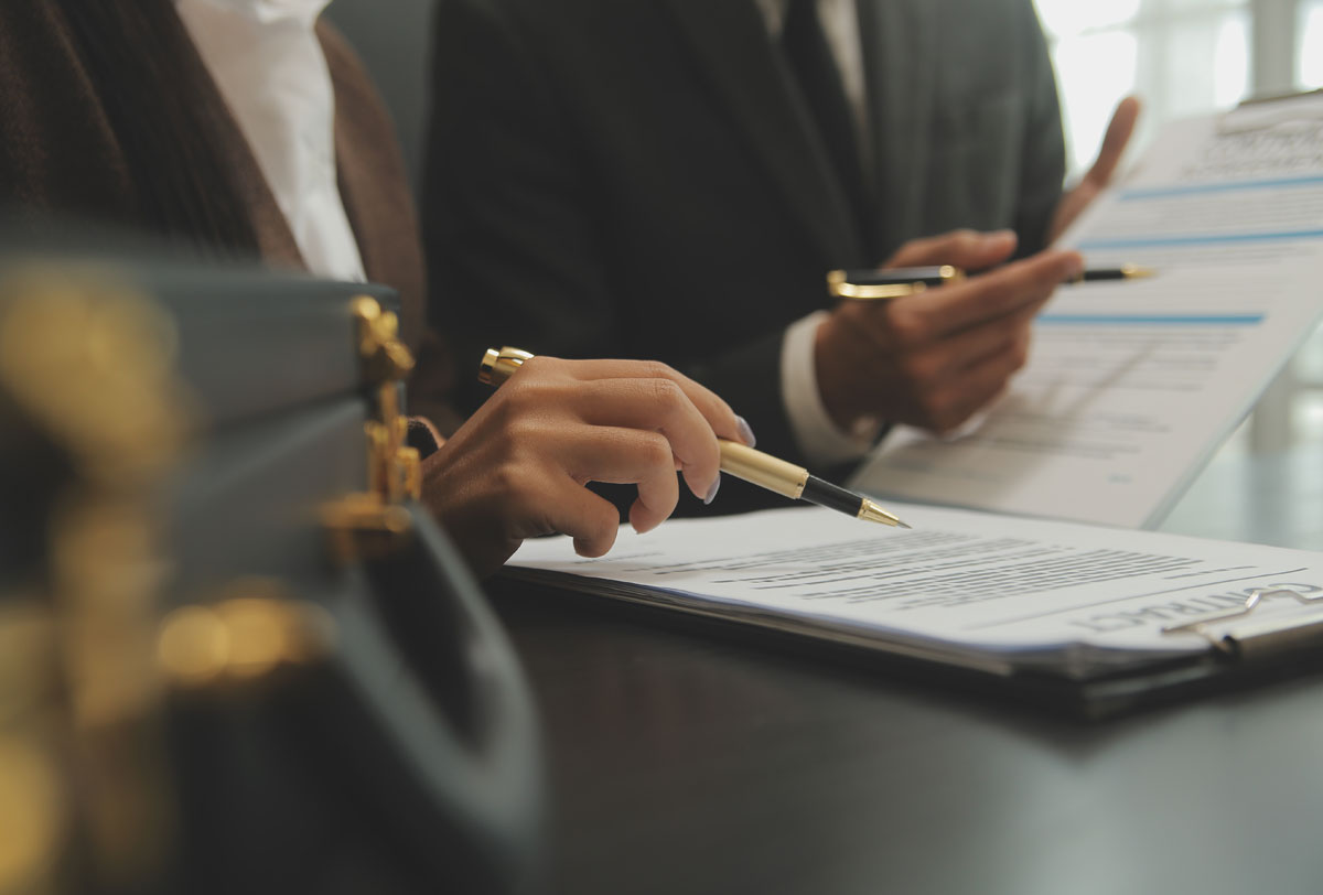 Criminal defense attorney consulting with client about legal strategy